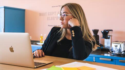 Woman sitting at a desk with laptop